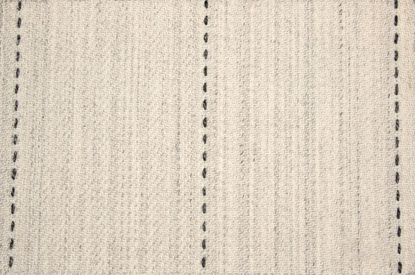 Broadloom carpet swatch in a stripe pattern in a light grey black design
