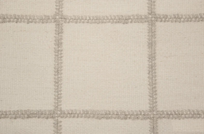 Broadloom carpet swatch in a checkered pattern in a cream design