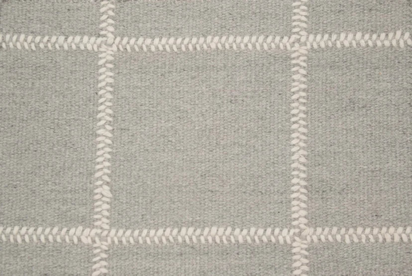 Broadloom carpet swatch in a checkered pattern in a light grey design