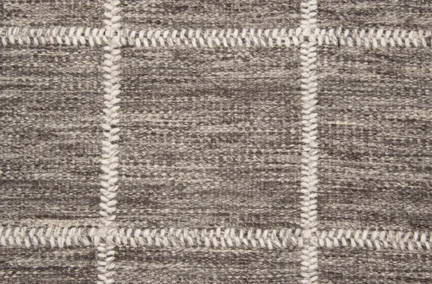 Broadloom carpet swatch in a checkered pattern in a brown design