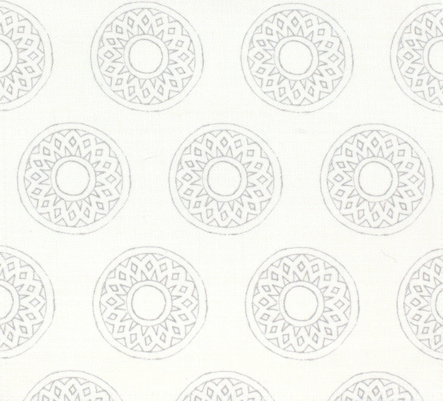 Detail of fabric in a repeating circular geometric print in light gray on a white field.