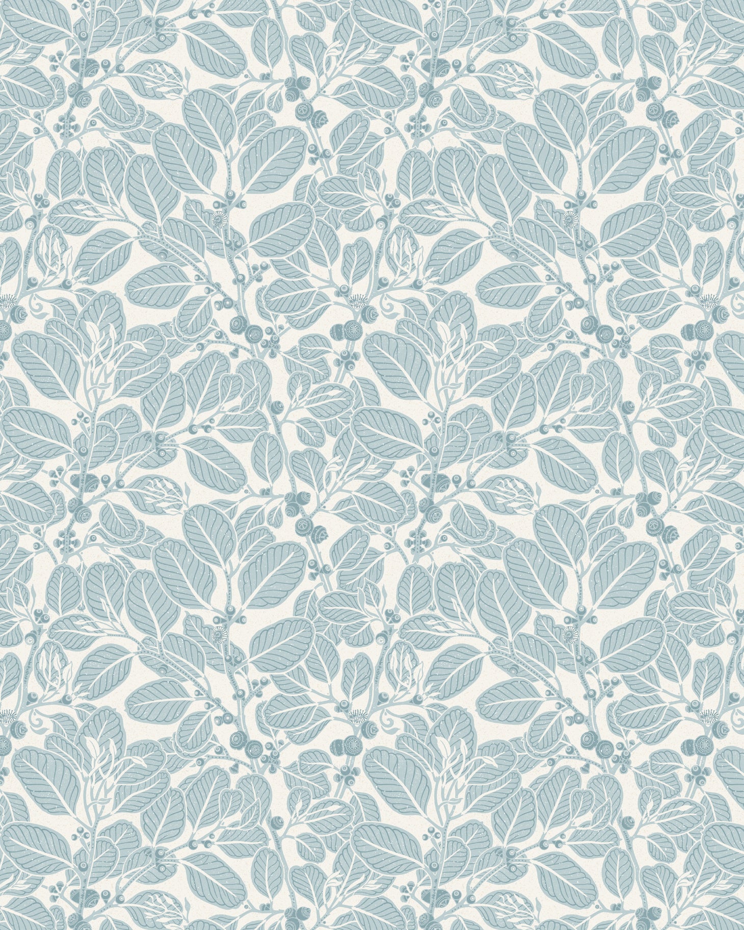 Two wooden chairs stand in front of a wall papered in a dense leaf and stem print in blue-gray and white.