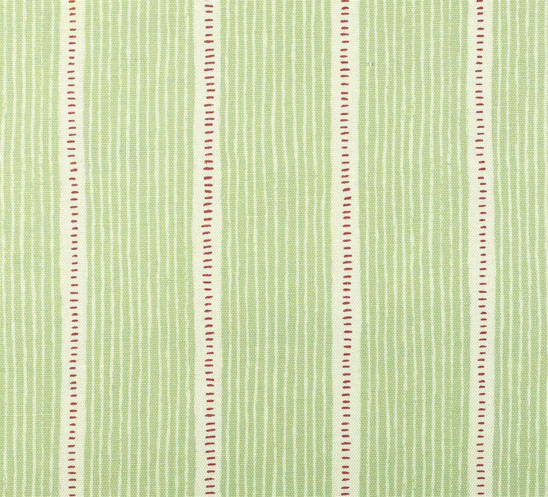 Detail of fabric in a repeating stripe and dash pattern in green and pink on a cream field.