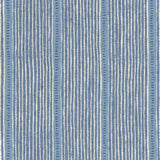 Detail of fabric in a repeating stripe and dash pattern in blue and navy on a cream field.