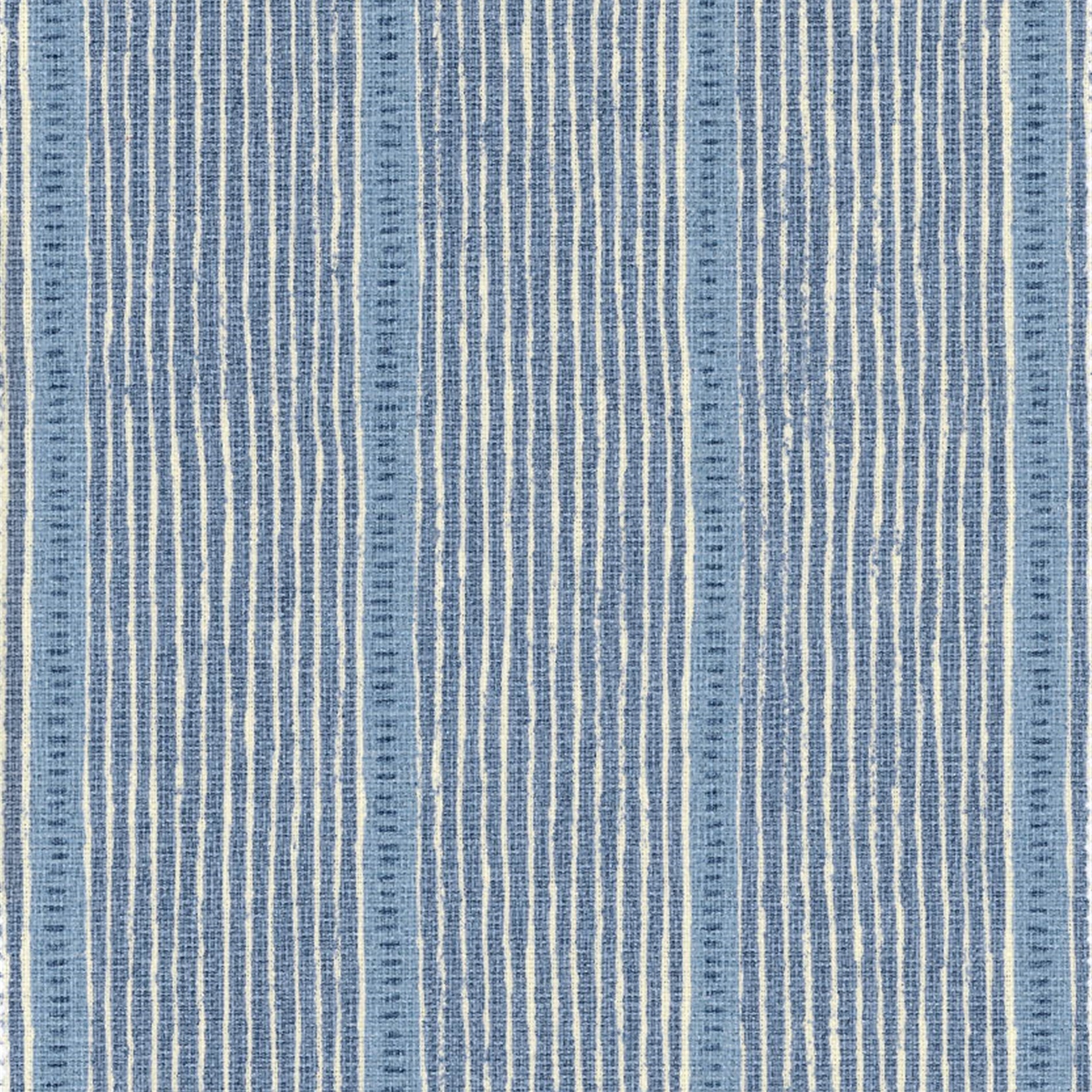 Detail of fabric in a repeating stripe and dash pattern in blue and navy on a cream field.