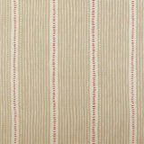 Detail of fabric in a repeating stripe and dash pattern in tan and red on a cream field.