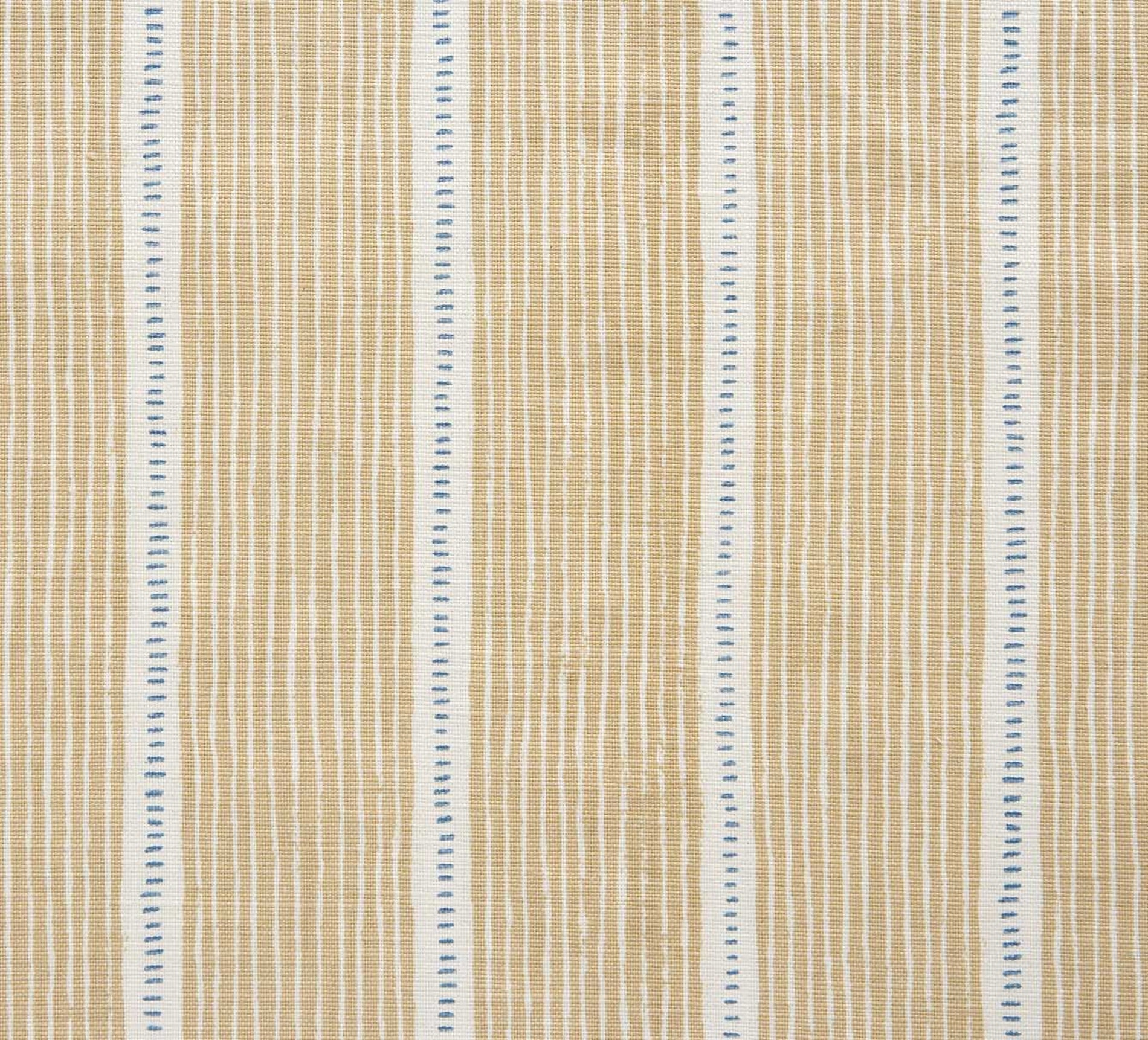 Detail of fabric in a repeating stripe and dash pattern in tan and blue on a cream field.