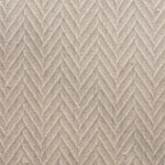 Broadloom carpet in a dimensional herringbone pattern in cream. 