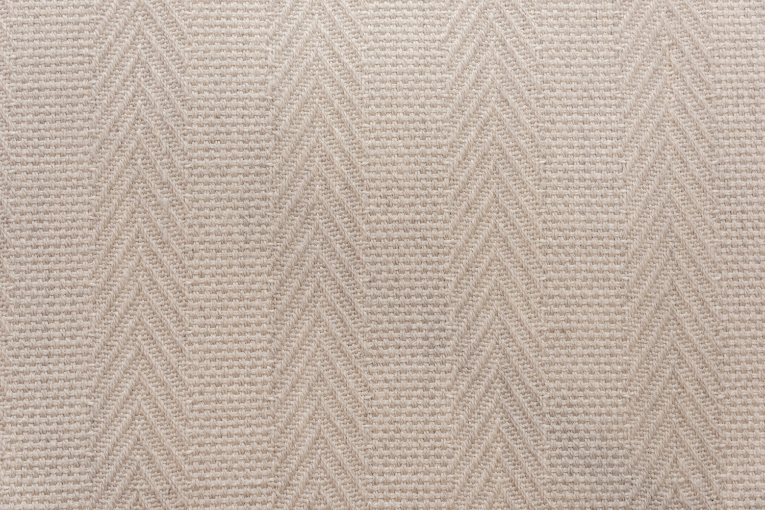 Broadloom carpet in a herringbone stripe in ecru.