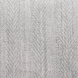 Broadloom carpet in a herringbone stripe in light grey. 