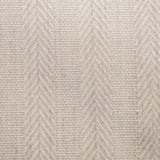 Broadloom carpet in a herringbone stripe in beige. 