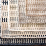 Stack of broadloom carpet samples in a ticking stripe pattern in an array of colors. 