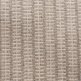 Broadloom carpet in a ticking stripe in shades of strié oatmeal. 