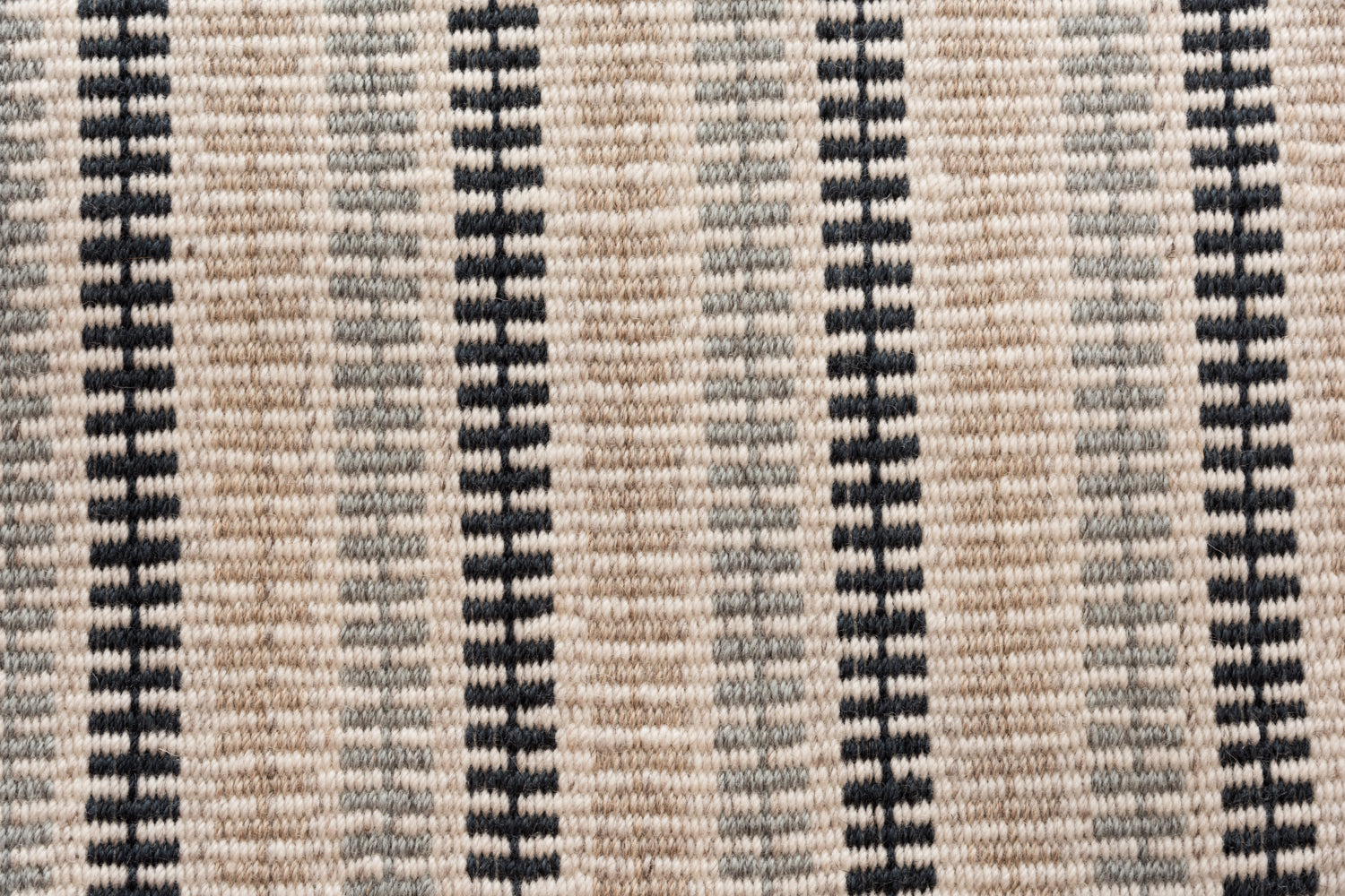 Broadloom carpet in a ticking stripe in shades of navy beige, and sage on cream.