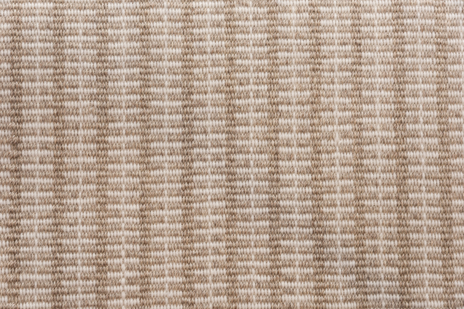 Broadloom carpet in a ticking stripe in shades of warm tan and cream. 