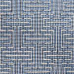 Broadloom carpet in a geometric stripe in cream and shades of blue. 