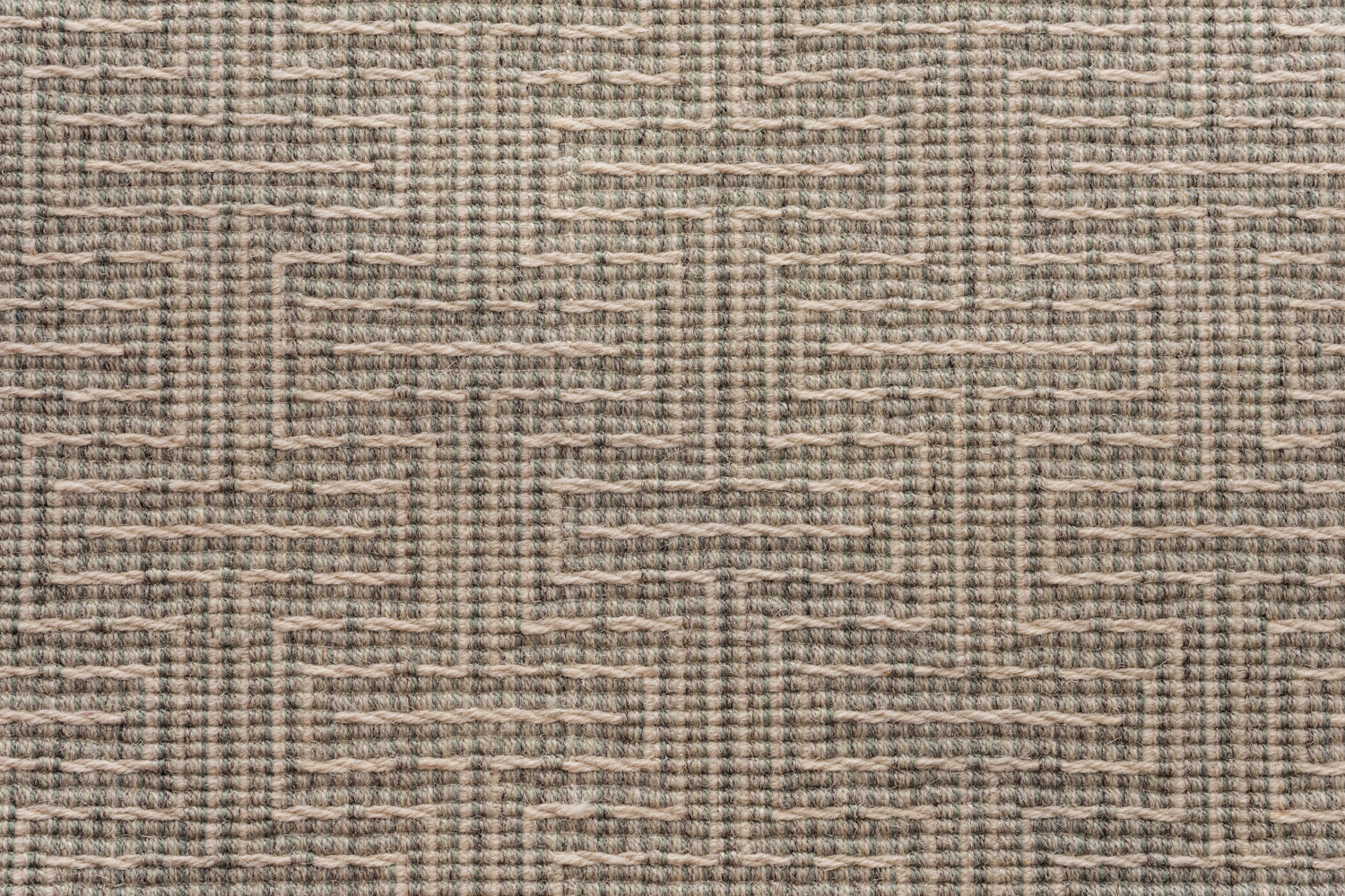 Broadloom carpet in a geometric stripe in cream and shades of sage green. 