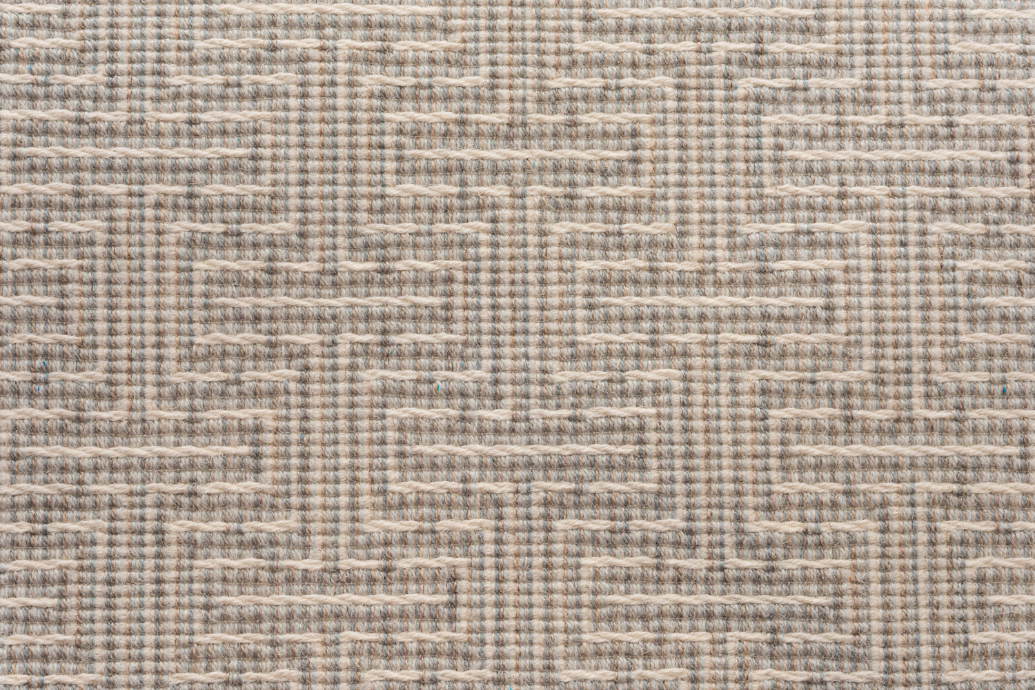Broadloom carpet in a geometric stripe in cream and shades of taupe, sage and grey. 