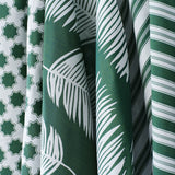 Performance fabrics in green and white in 
a palm print, moroccan star and simple stripe.