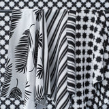 Performance fabrics in black and white in 
a palm print, moroccan star and simple stripe.