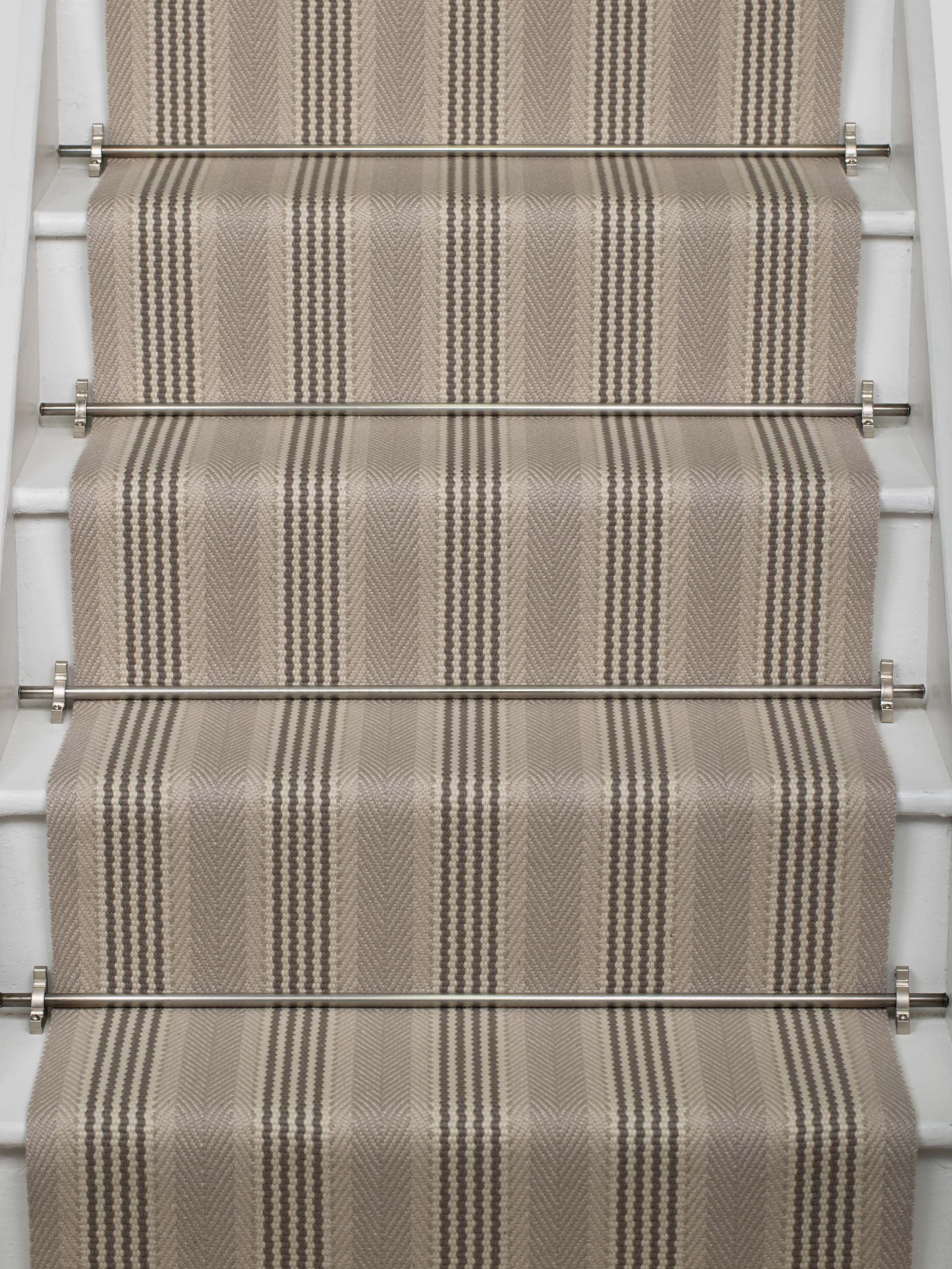 Striped flatweave runner in grey and black on white staircase