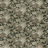 printed linen fabric in a detailed floral pattern in shades of beige and brown on a black field.