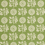 Detail of fabric in a repeating sunflower print in white on an olive field.