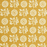Detail of fabric in a repeating sunflower print in white on a mustard field.