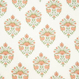 Detail of fabric in a floral paisley print in shades of green and coral on a white field.
