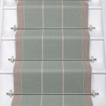 Striped flatweave runner in blue and grey on white staircase