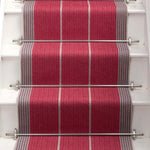Striped flatweave runner in red and grey on white staircase