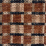 Close-up of a woven plaid rug with brown, black, and beige.