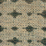 Close-up of a woven rug  with a diamond pattern in shades of green.