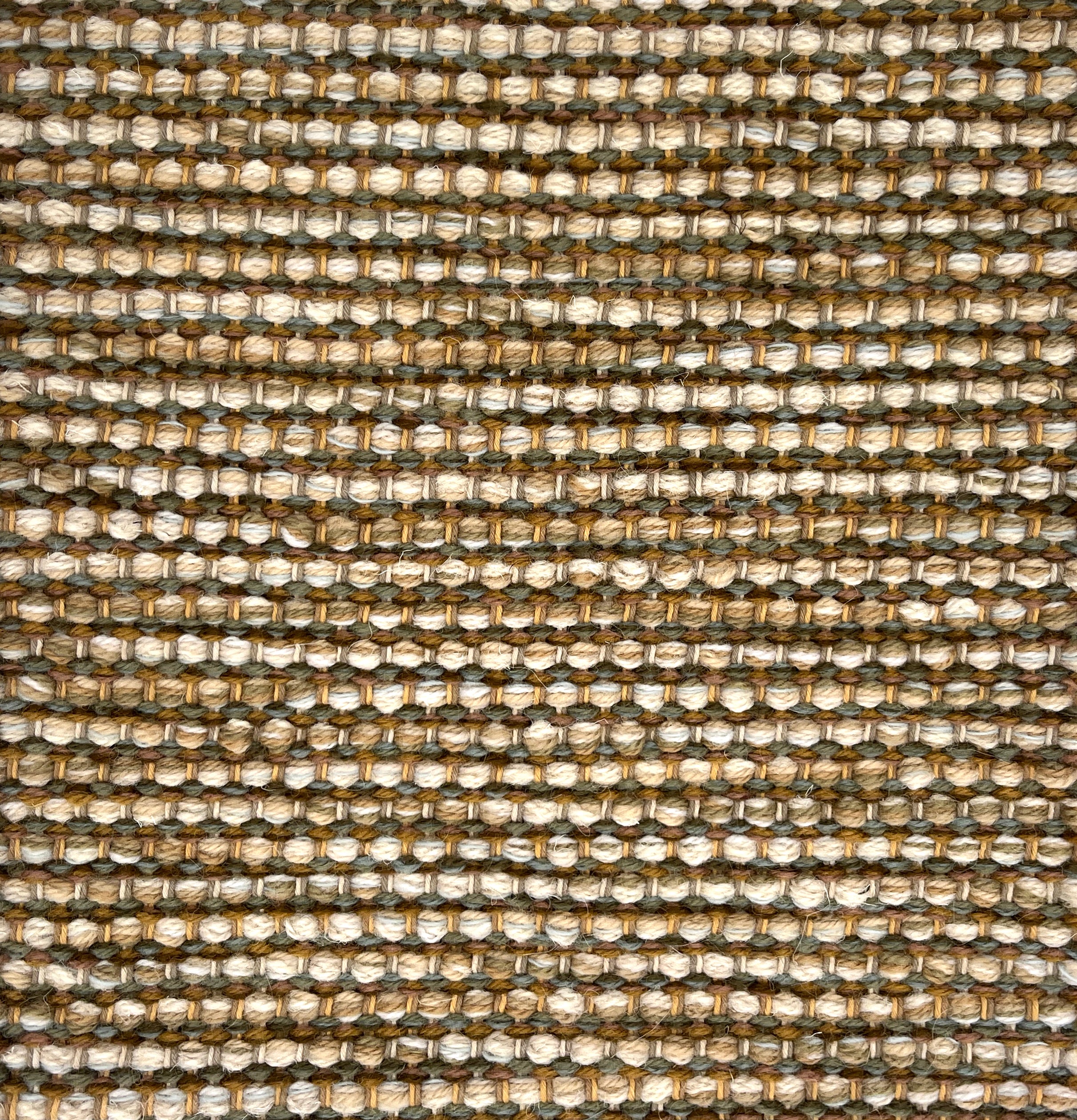 Textured handwoven rug with a strié pattern in earth tones.