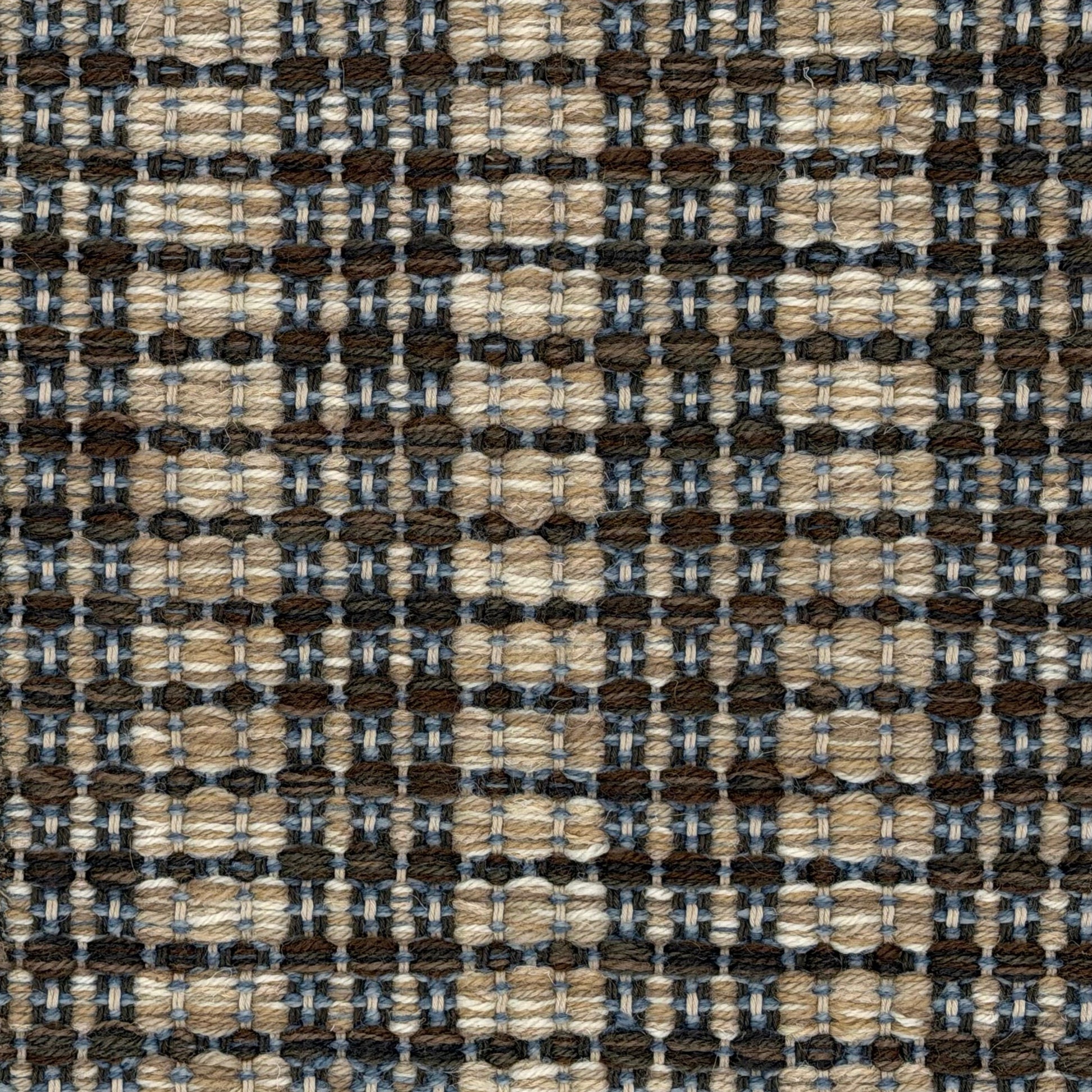 A close-up of a woven rug featuring a variegated stripe design in brown, blue and tan. 