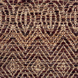 Close-up of a woven rug with subtle geometric design in brown and purple.