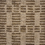 Close-up of a textured brown and beige rug