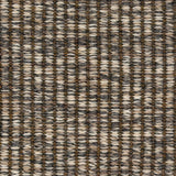 A close-up of a woven wool rug a ribbed stripe in shades of grey, cream and taupe. 