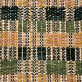 Close-up of a woven rug with a checkered pattern in earthy tones.