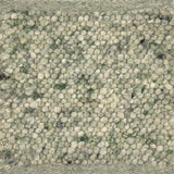 Close-up of nubby textured green handmade rg