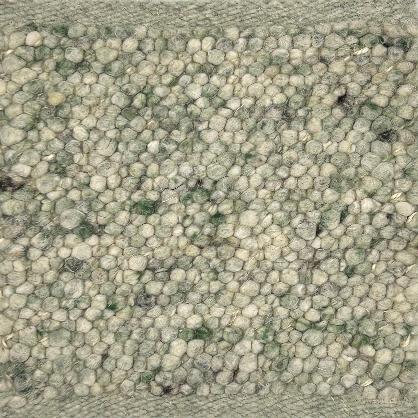 Close-up of nubby textured green handmade rg