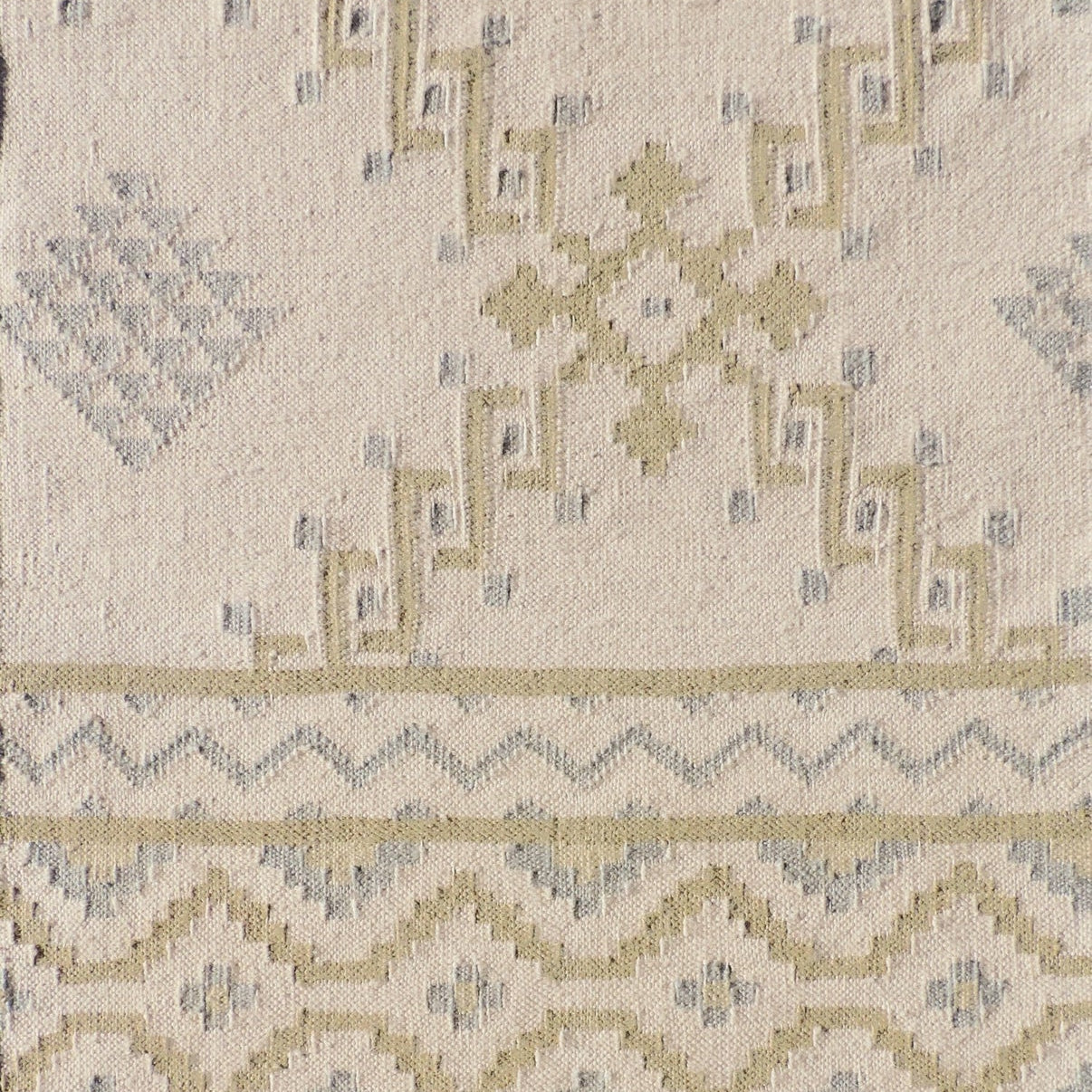 Patterned rug with geometric design on a beige background