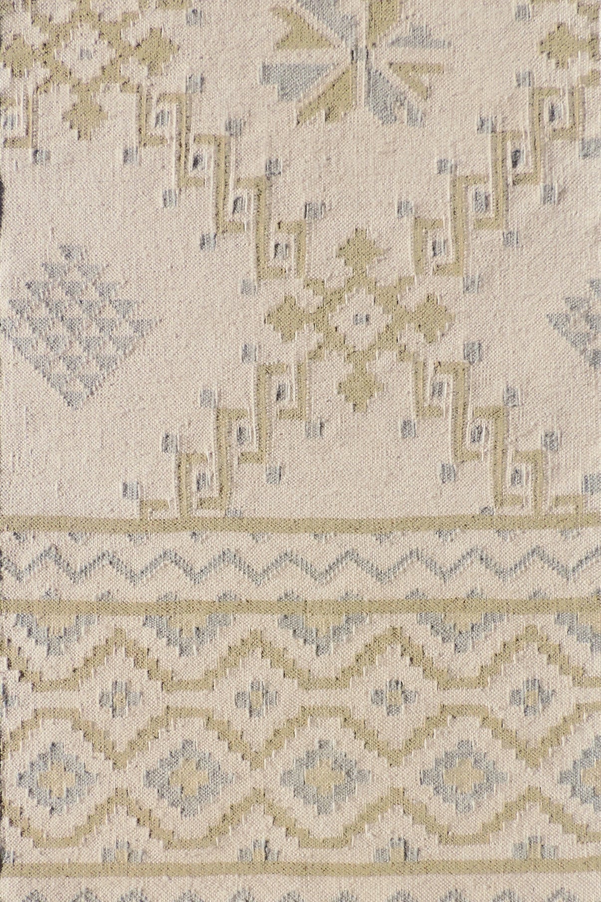 Patterned rug with geometric design on a beige background