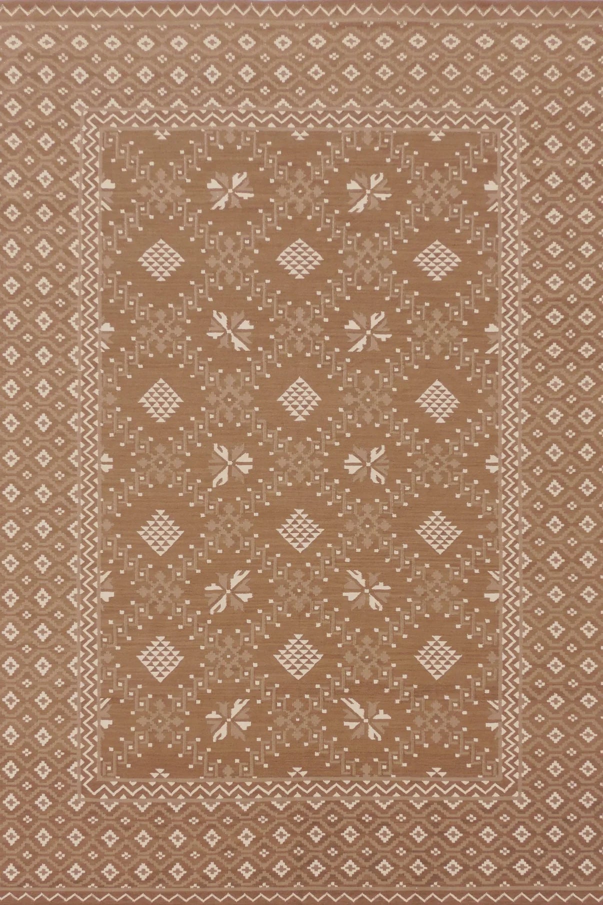 Patterned rug with geometric design on a beige background