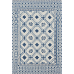 Rug with blue and white geometric pattern on a plain background