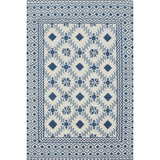Rug with blue and white geometric pattern on a plain background