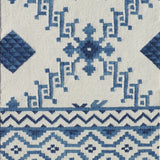 Rug with blue geometric pattern on a white background