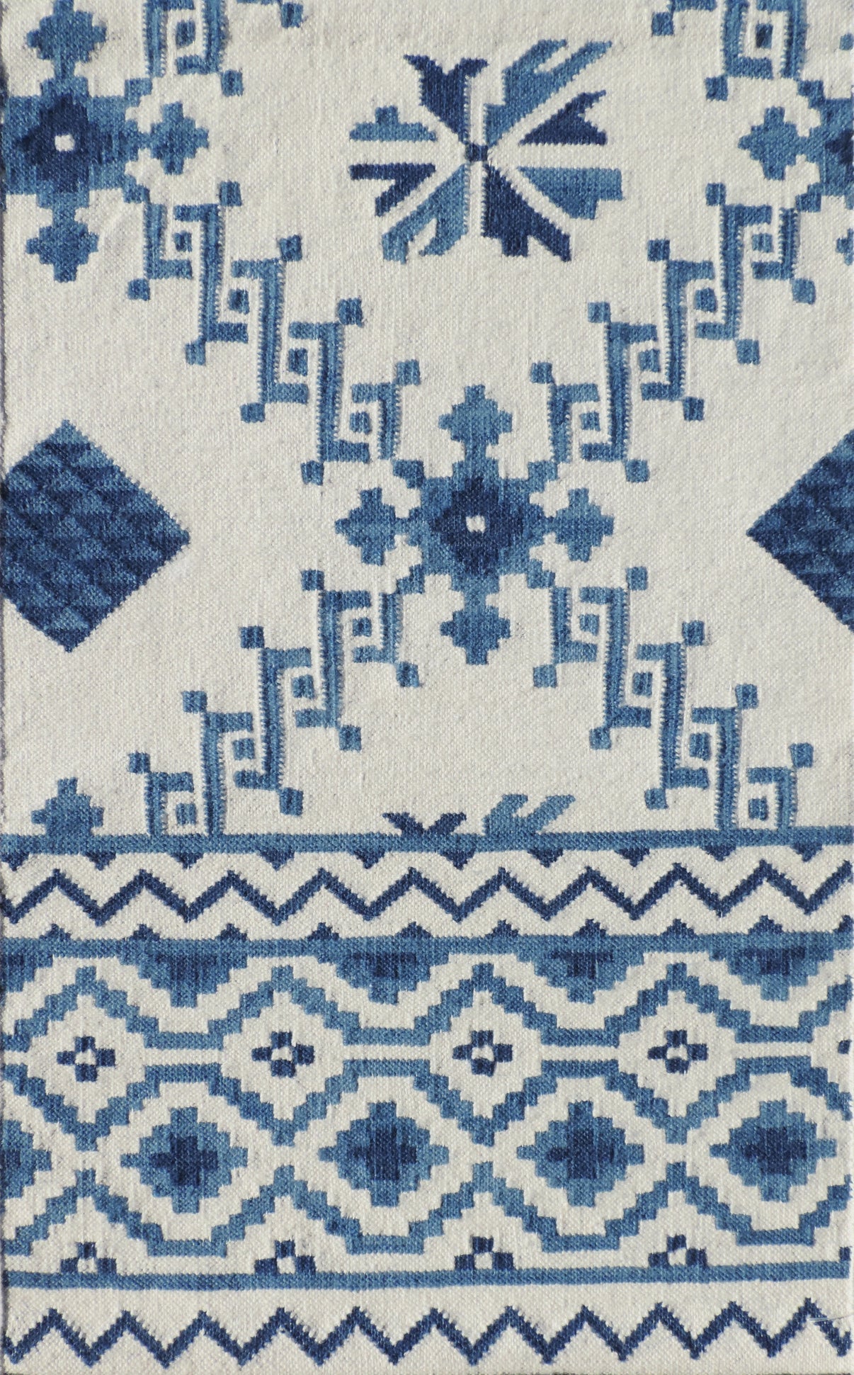 Rug with blue geometric pattern on a white background