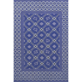 Blue patterned rug with geometric design on a white background