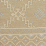 Beige area rug with geometric pattern